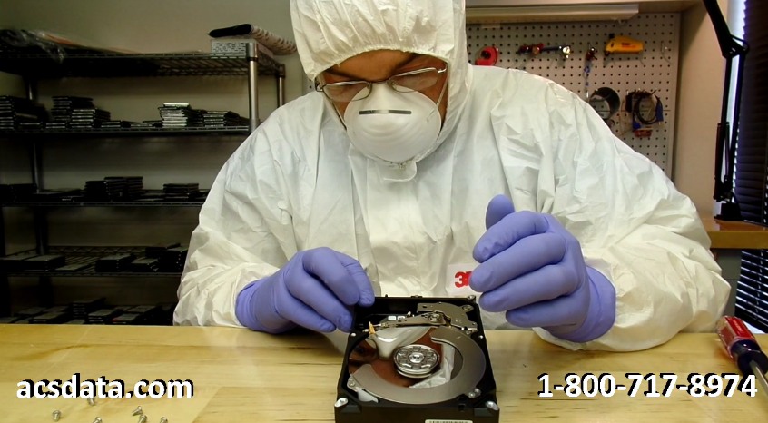 Examining the heads on a Seagate 3TB hard drive that was dropped